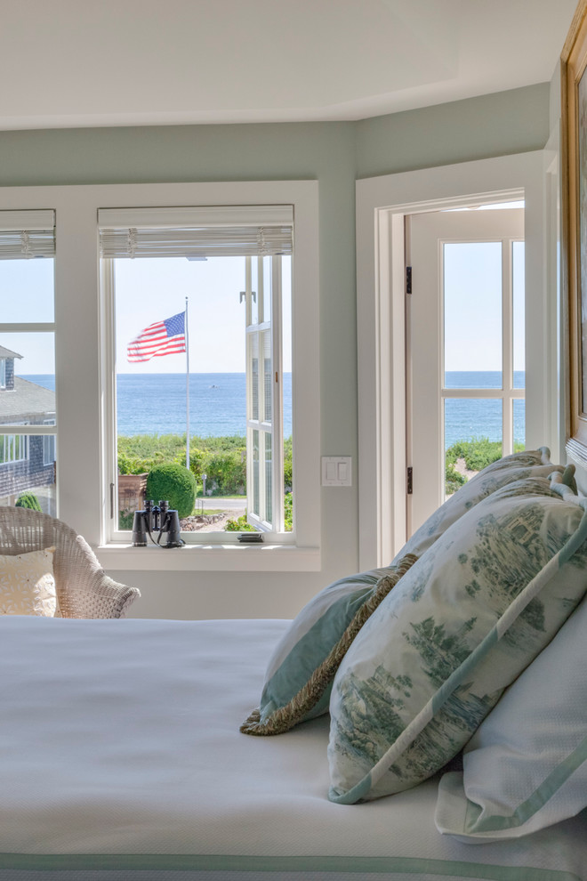 Inspiration for a large coastal master medium tone wood floor and brown floor bedroom remodel in Boston with green walls and no fireplace