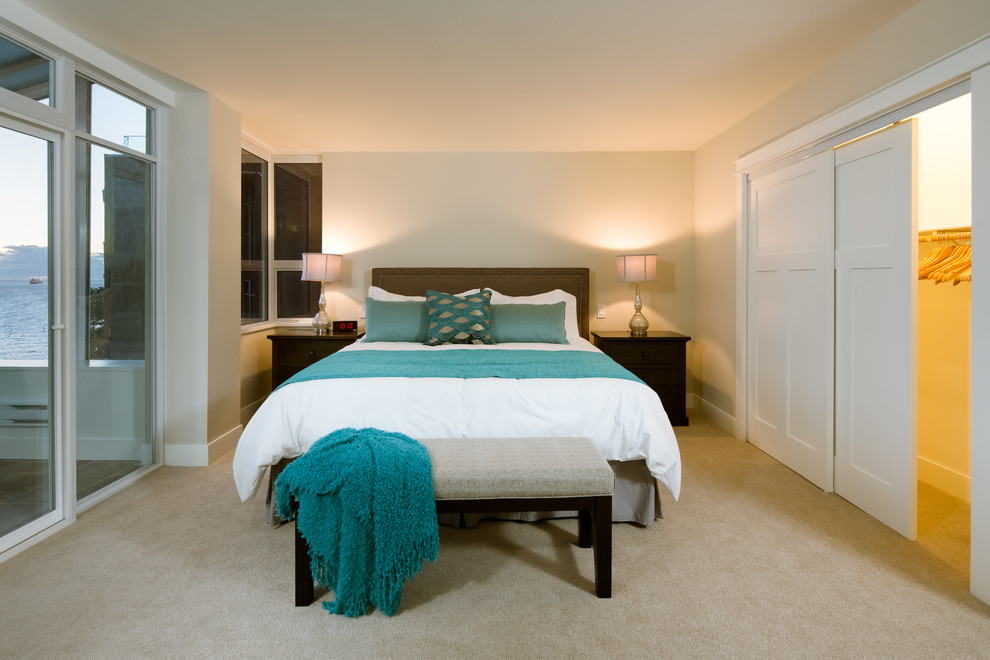 Example of a mid-sized minimalist master carpeted bedroom design with beige walls