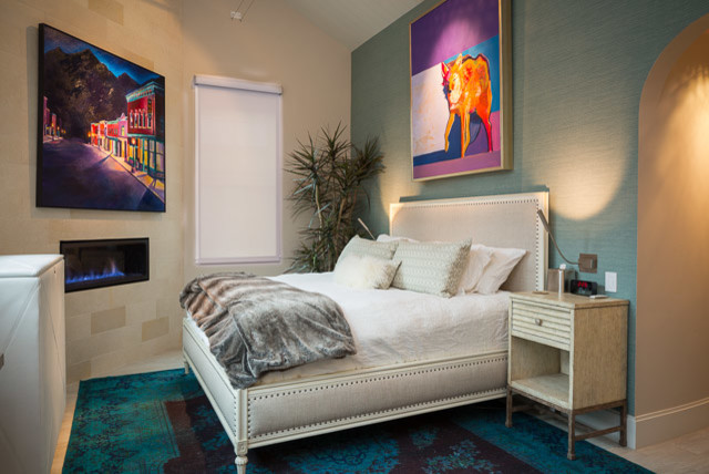 This is an example of a small modern guest and grey and cream bedroom in Denver with beige walls, light hardwood flooring, a corner fireplace and a tiled fireplace surround.