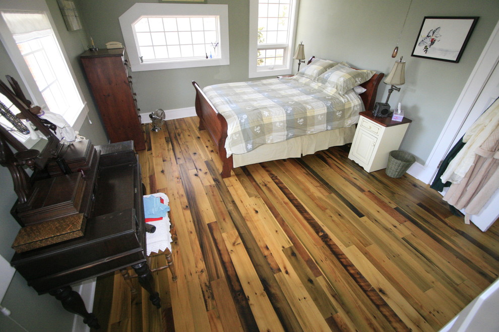 Example of a cottage medium tone wood floor bedroom design in Vancouver