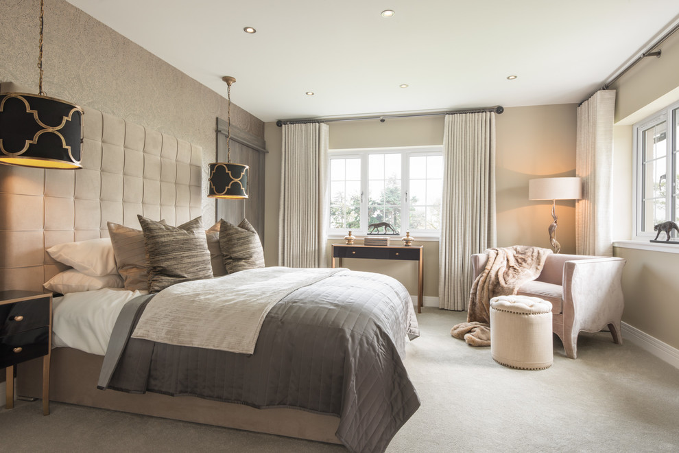 Inspiration for a large transitional master carpeted bedroom remodel in London with beige walls and no fireplace
