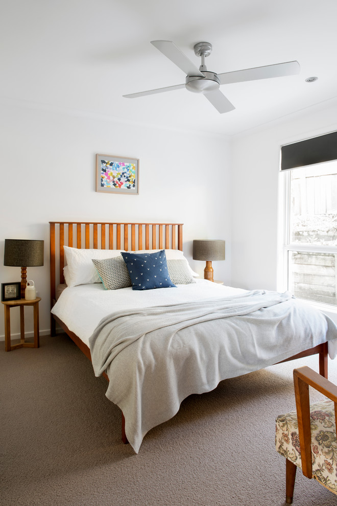 Contemporary bedroom in Sunshine Coast with white walls, carpet and no fireplace.