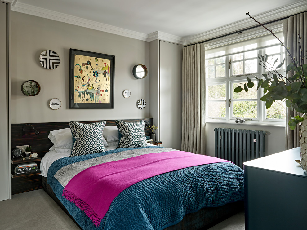 This is an example of a contemporary master and grey and pink bedroom in Other with grey walls, carpet and grey floors.