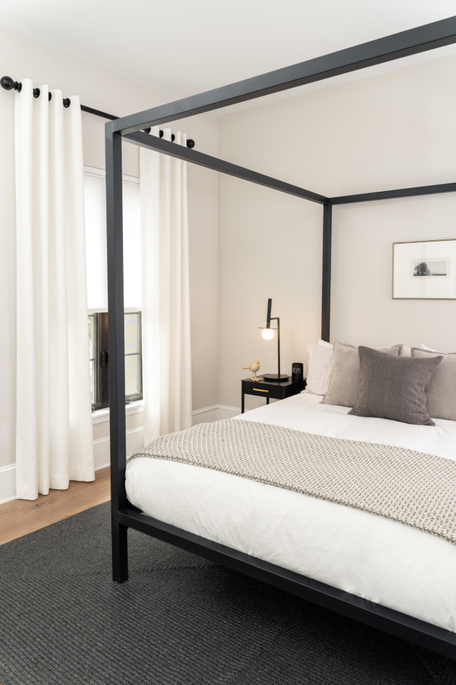 Esempio di una camera degli ospiti moderna di medie dimensioni con pareti bianche, pavimento in vinile e pavimento marrone