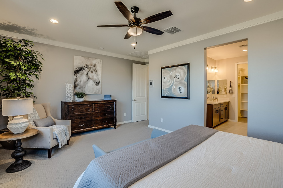 Medium sized contemporary master bedroom in Phoenix with beige walls, carpet and beige floors.