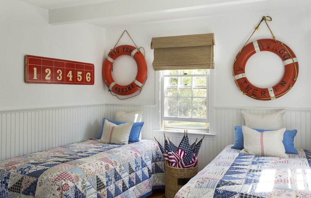 Example of a beach style guest bedroom design in Boston with white walls and no fireplace