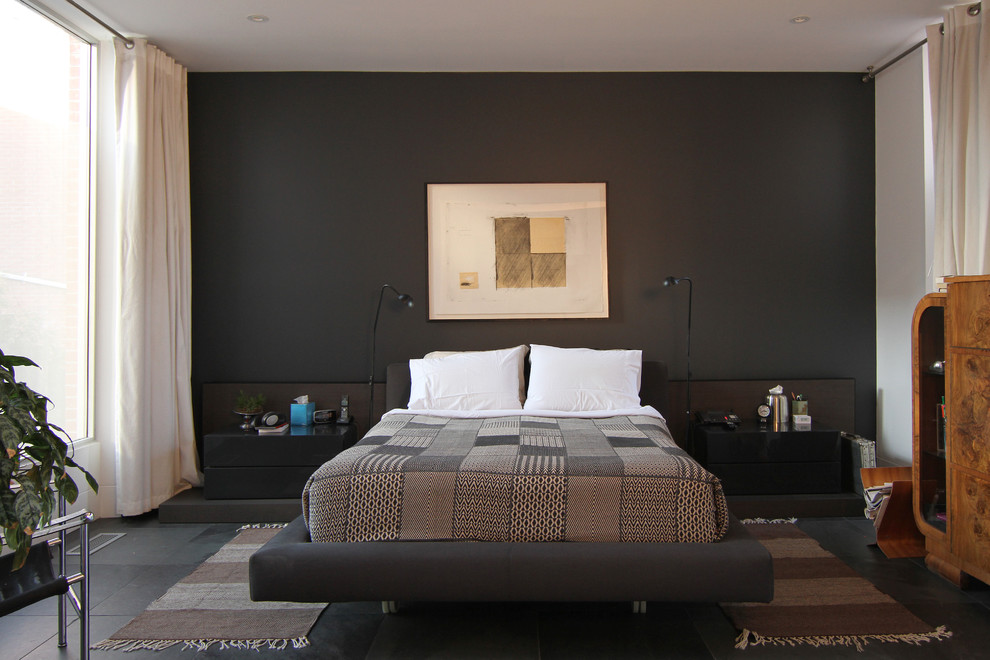 Contemporary master and cream and black bedroom in Toronto with black walls, no fireplace and black floors.