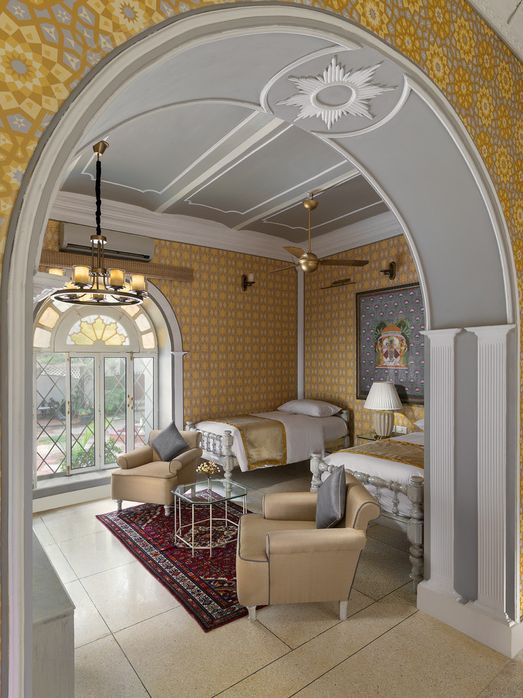 Example of a mid-sized transitional ceramic tile and brown floor bedroom design in Delhi