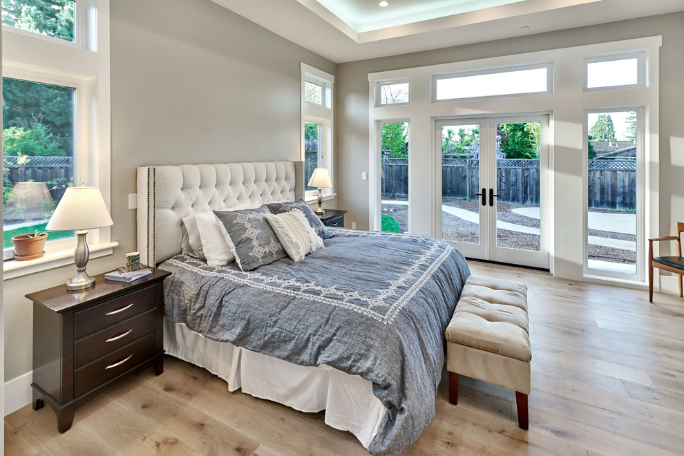Inspiration for a medium sized traditional master bedroom in San Francisco with brown walls, light hardwood flooring, no fireplace and brown floors.