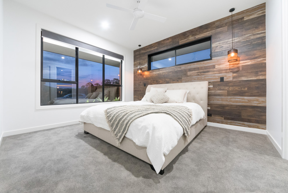 Diseño de dormitorio principal urbano de tamaño medio con paredes blancas, moqueta y suelo gris