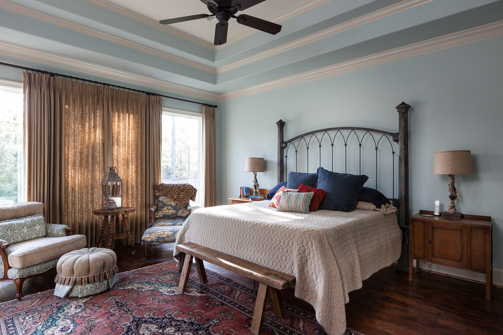 Inspiration for a medium sized contemporary master bedroom in Houston with blue walls and medium hardwood flooring.