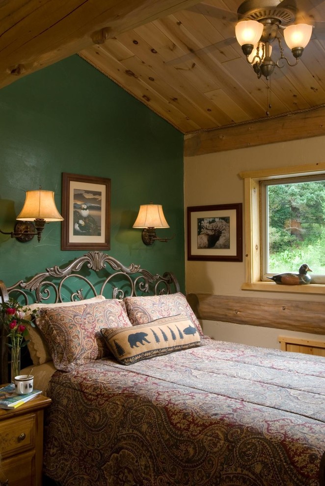Inspiration for a rustic bedroom in Boise with green walls and feature lighting.