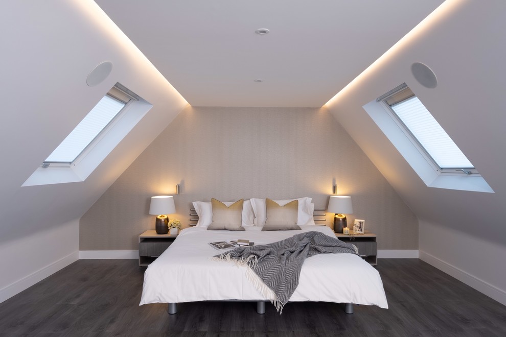 Traditional bedroom in Buckinghamshire with white walls, dark hardwood flooring and black floors.