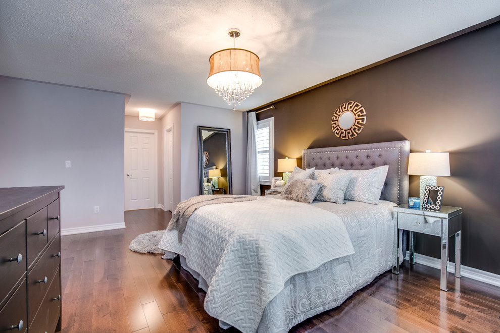 Inspiration for a medium sized contemporary master bedroom in Toronto with brown walls, dark hardwood flooring and brown floors.