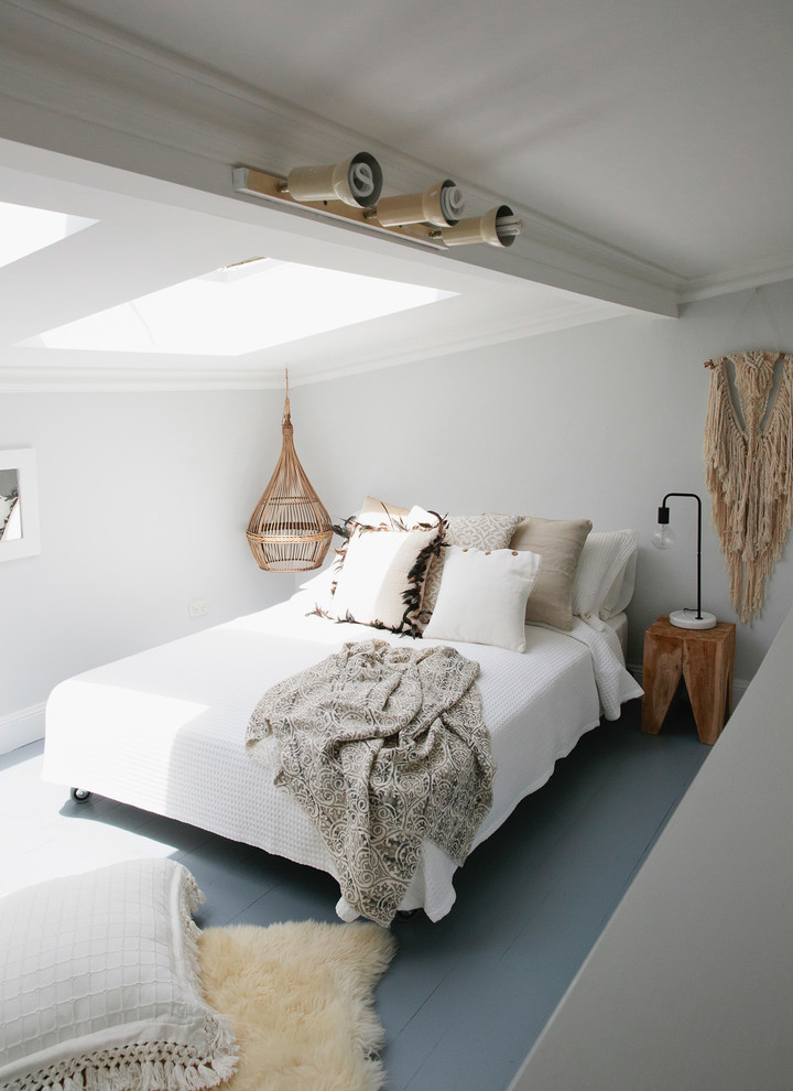 Design ideas for a medium sized scandinavian master bedroom in Sydney with white walls and light hardwood flooring.