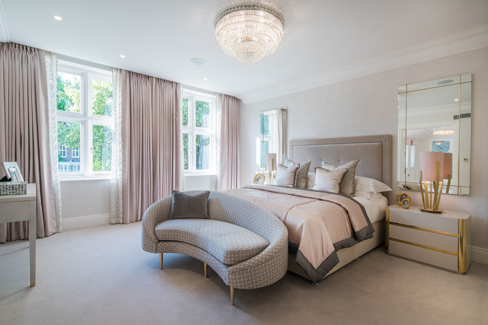This is an example of a medium sized classic grey and pink bedroom in London with carpet and grey floors.