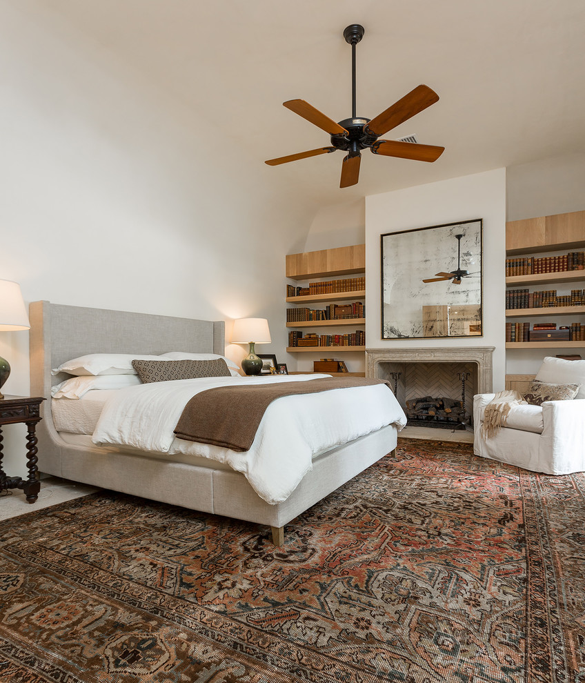 Bedroom - large transitional master ceramic tile bedroom idea in Miami with white walls, a standard fireplace and a stone fireplace