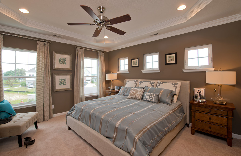 Example of a classic carpeted bedroom design in Other with gray walls