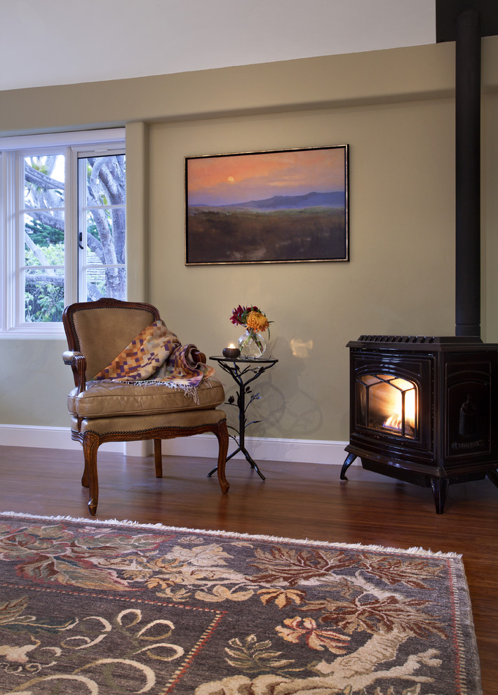 This is an example of a classic bedroom in San Francisco with a wood burning stove.