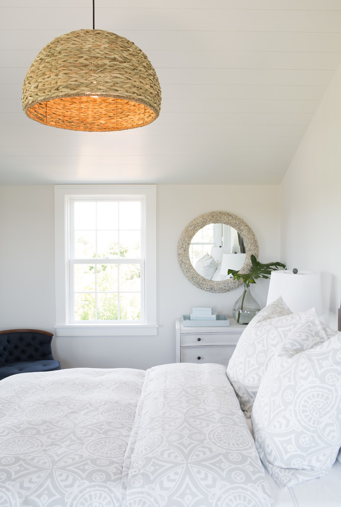 Inspiration for a large coastal guest bedroom in Boston with white walls.