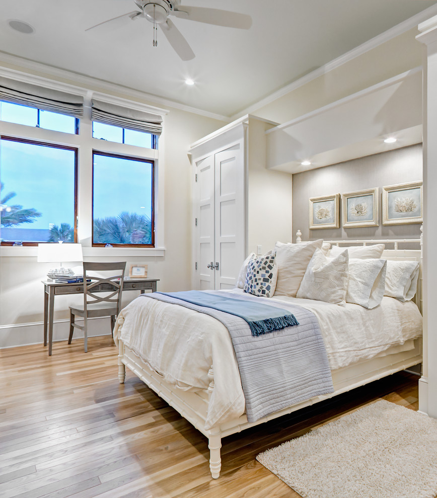 Inspiration for a beach style bedroom in Jacksonville with beige walls.