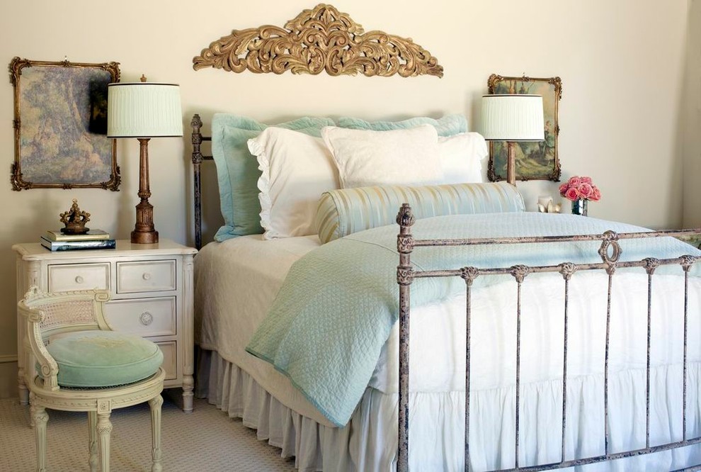 Example of a cottage chic carpeted bedroom design in Little Rock with beige walls