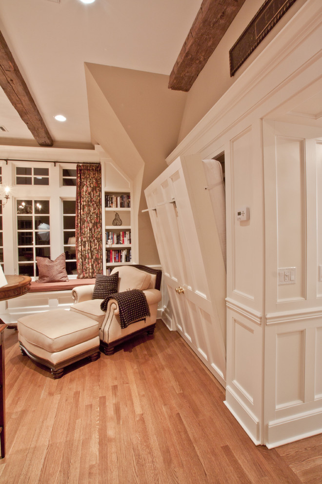Example of a huge classic guest medium tone wood floor bedroom design in Philadelphia with beige walls