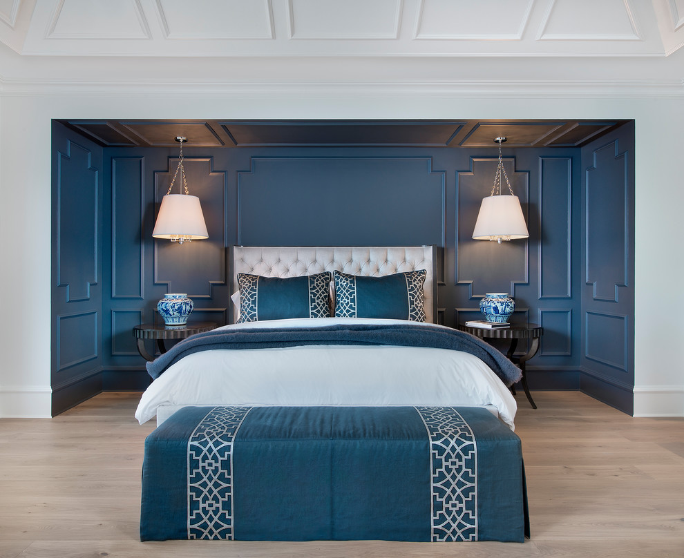 Inspiration for a classic master bedroom in Cleveland with blue walls, light hardwood flooring and beige floors.