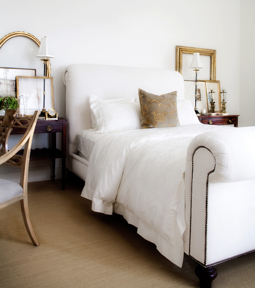 Example of a classic carpeted bedroom design in Orange County with white walls
