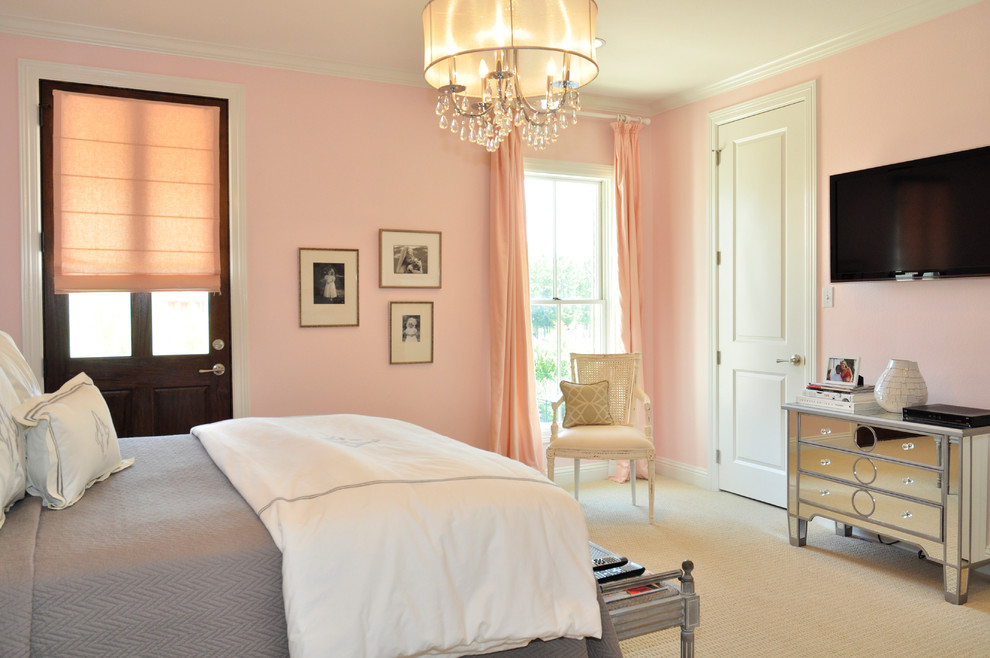 Elegant master carpeted bedroom photo in New Orleans with pink walls