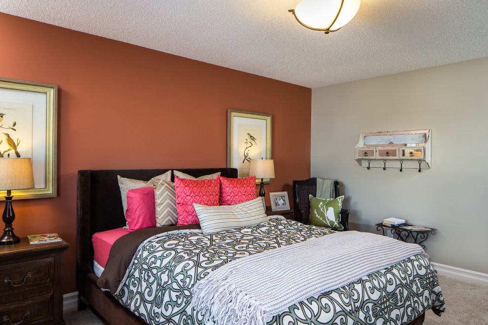 Inspiration for a medium sized traditional master bedroom in Edmonton with orange walls, carpet and no fireplace.