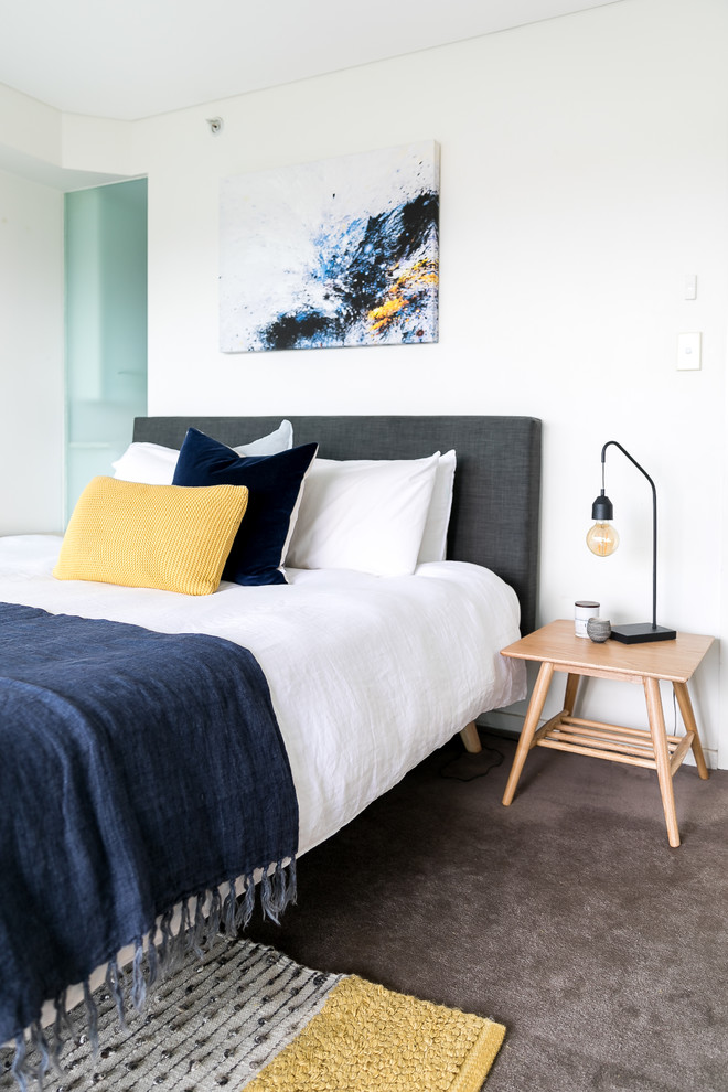 Example of a large minimalist master carpeted and gray floor bedroom design in Sydney with white walls