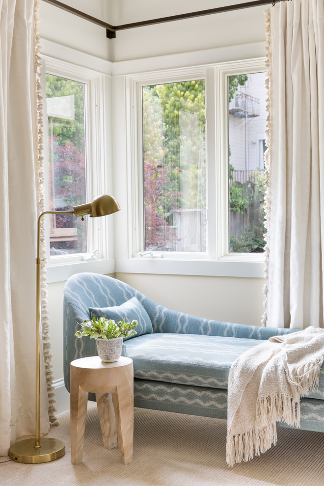 Bohemian master bedroom in San Francisco with beige walls, carpet and beige floors.