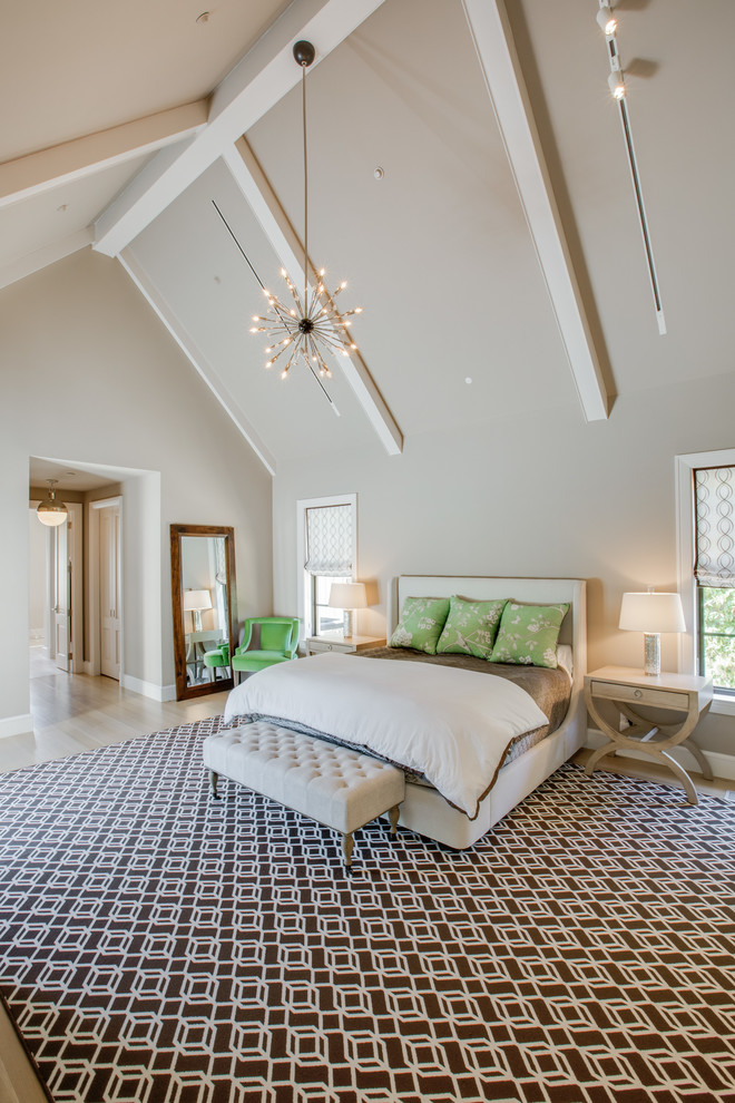 This is an example of a contemporary master bedroom in Dallas with beige walls, light hardwood flooring and no fireplace.
