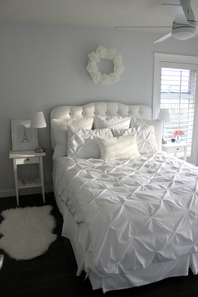 Inspiration for a medium sized romantic master bedroom in Vancouver with medium hardwood flooring and no fireplace.