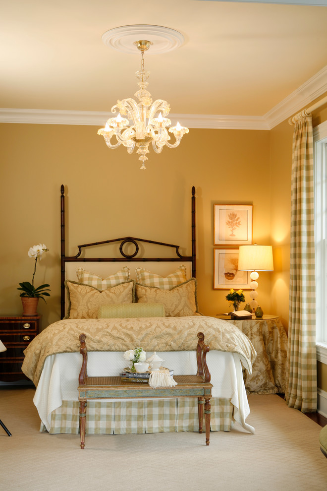 This is an example of a medium sized traditional guest bedroom in New York with beige walls, no fireplace and carpet.