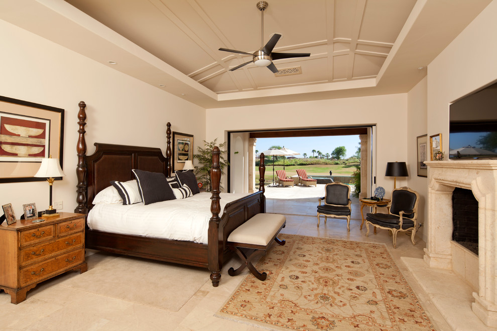 Bild på ett medelhavsstil sovrum, med beige väggar och en standard öppen spis