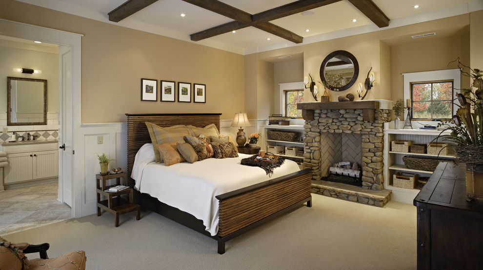 Idée de décoration pour une chambre chalet avec un manteau de cheminée en pierre et une cheminée standard.