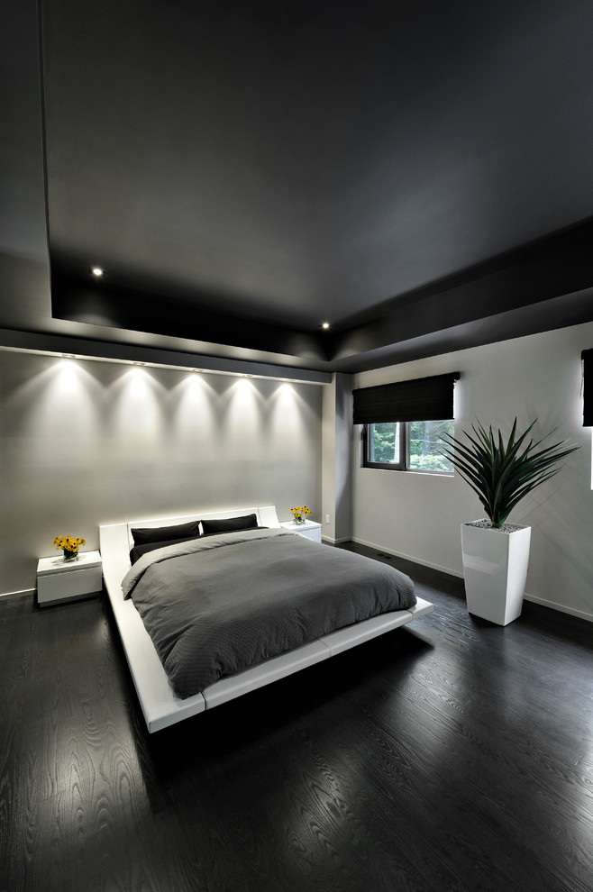 Example of a minimalist bedroom design in Montreal