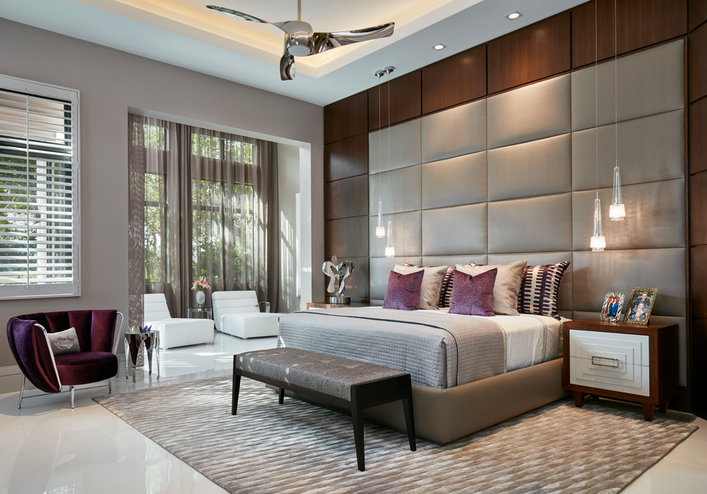 Inspiration for a large contemporary master and grey and silver bedroom in Miami with grey walls and no fireplace.