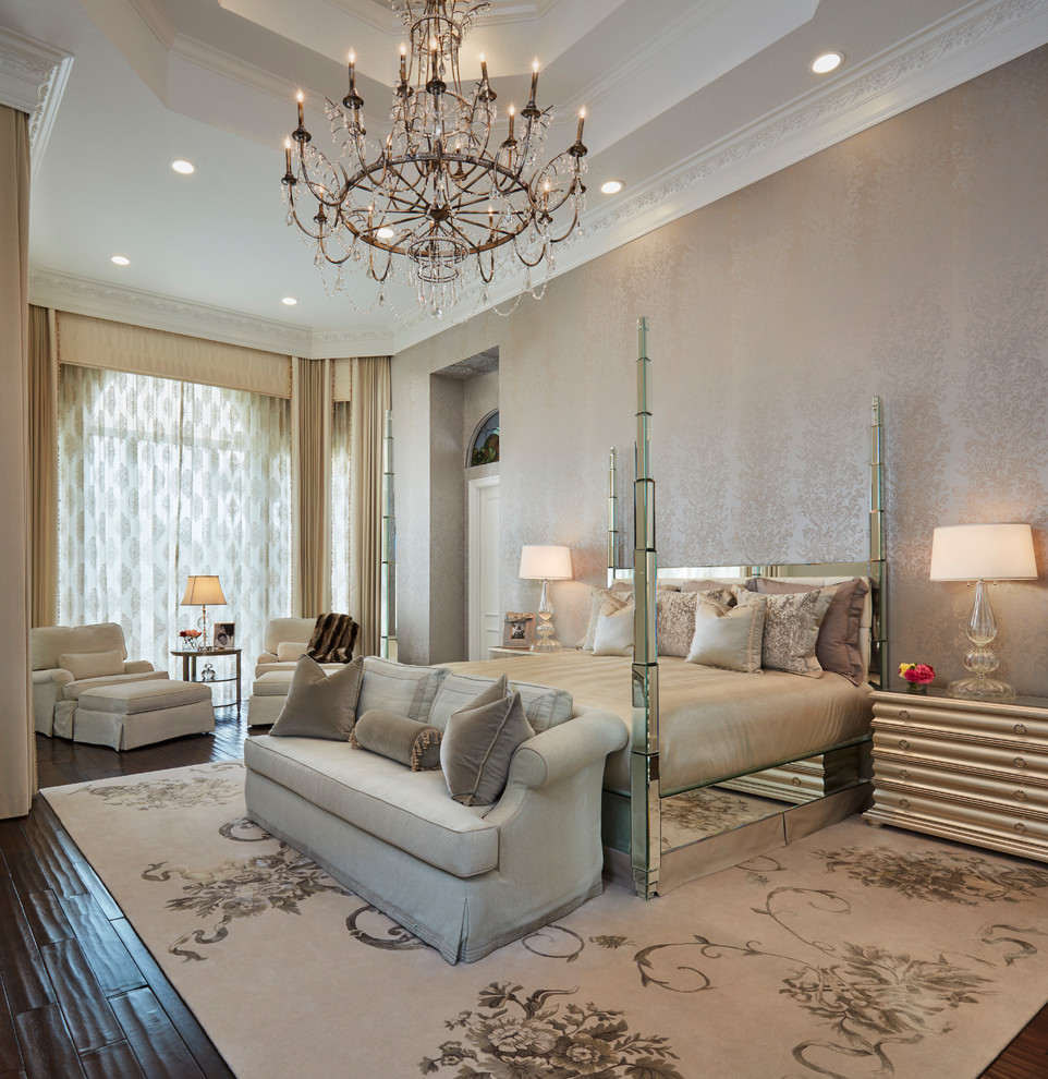 Classic master bedroom in Miami with beige walls and dark hardwood flooring.