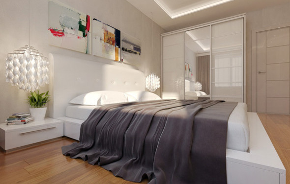 Ejemplo de habitación de invitados moderna pequeña sin chimenea con paredes blancas y suelo de madera clara