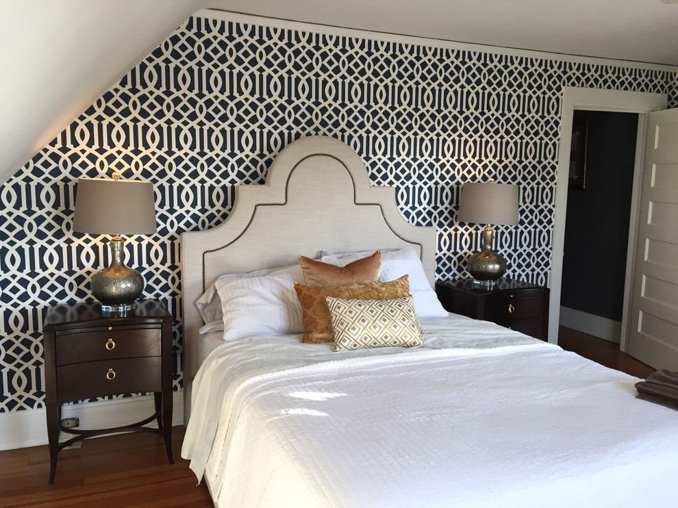 Medium sized traditional guest bedroom in Cedar Rapids with black walls, medium hardwood flooring, no fireplace and brown floors.