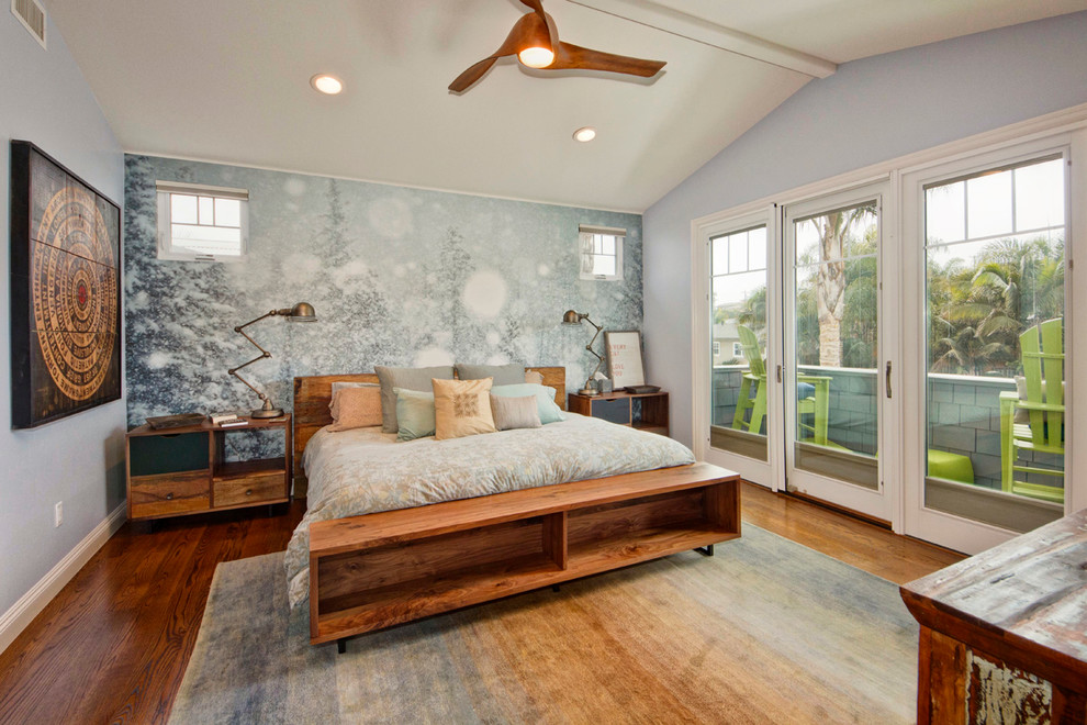 Inspiration for a contemporary medium tone wood floor bedroom remodel in San Diego with gray walls