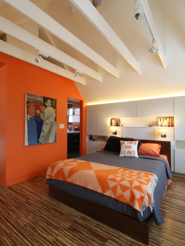 Mid-sized trendy dark wood floor bedroom photo in Boston with orange walls