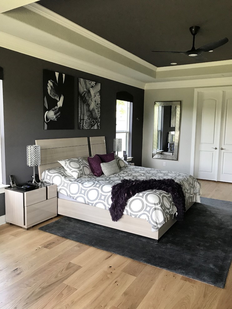Design ideas for a large contemporary master bedroom in Dallas with grey walls, light hardwood flooring, beige floors and no fireplace.