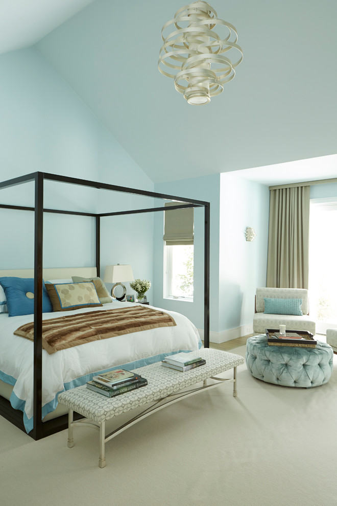 This is an example of a contemporary bedroom in New York with blue walls.