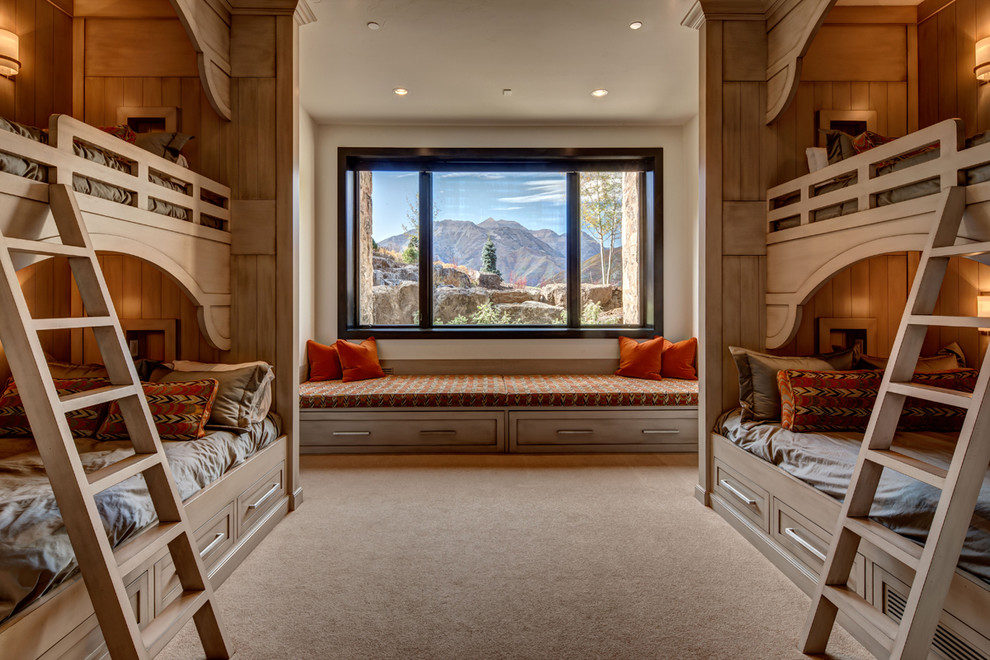 This is an example of a rustic guest bedroom in Salt Lake City with beige walls, carpet and beige floors.