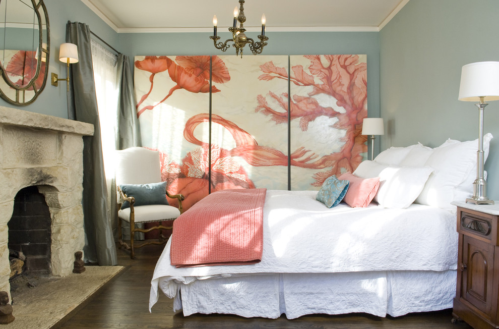 Tuscan dark wood floor bedroom photo in Santa Barbara with gray walls, a standard fireplace and a stone fireplace