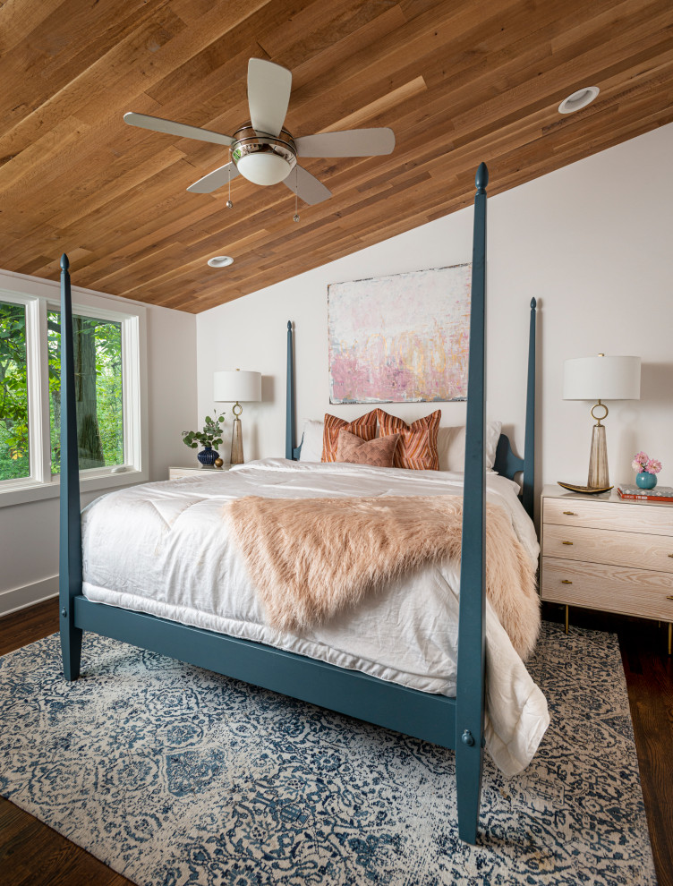 Example of a transitional dark wood floor and brown floor bedroom design in Nashville with white walls